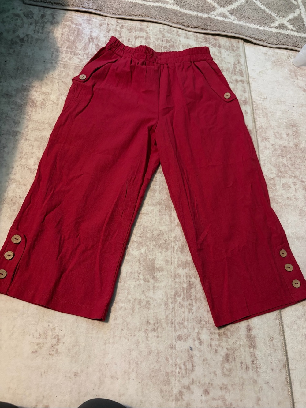Vibrant red cotton capris with wooden buttons